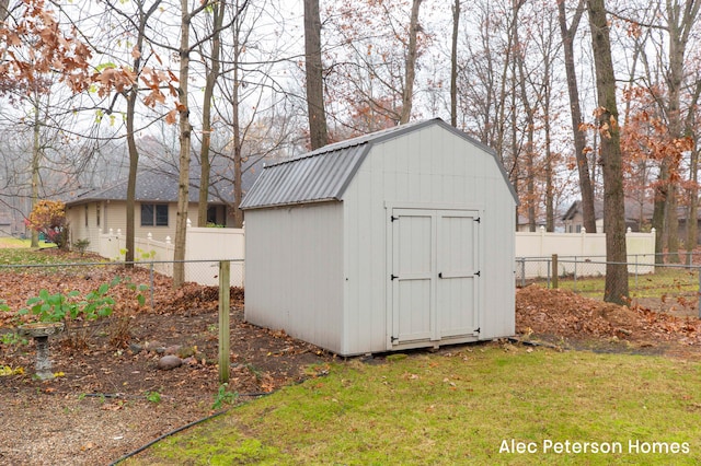 view of outbuilding featuring a yard