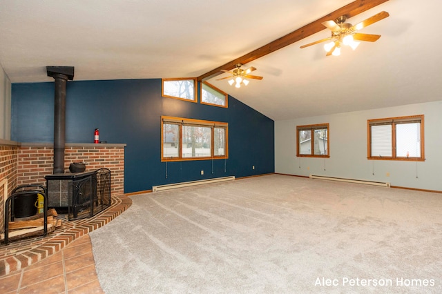 living room featuring vaulted ceiling with beams, light colored carpet, a wood stove, and baseboard heating