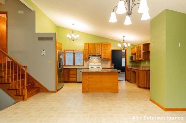 kitchen with decorative light fixtures, stainless steel appliances, and an inviting chandelier