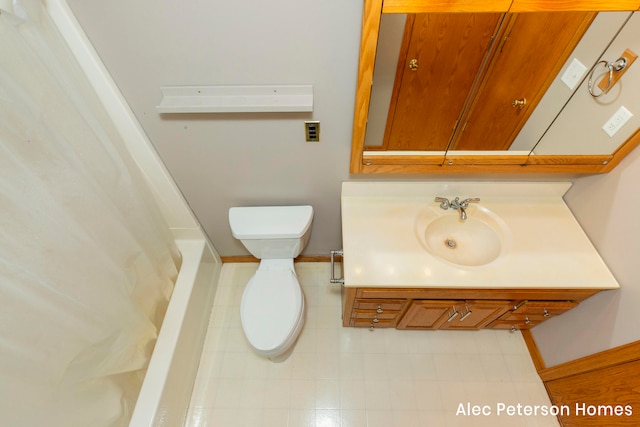 bathroom featuring vanity and toilet