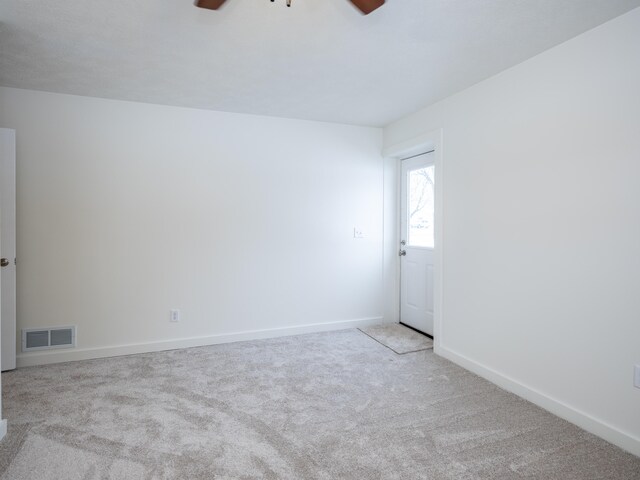 spare room with light colored carpet