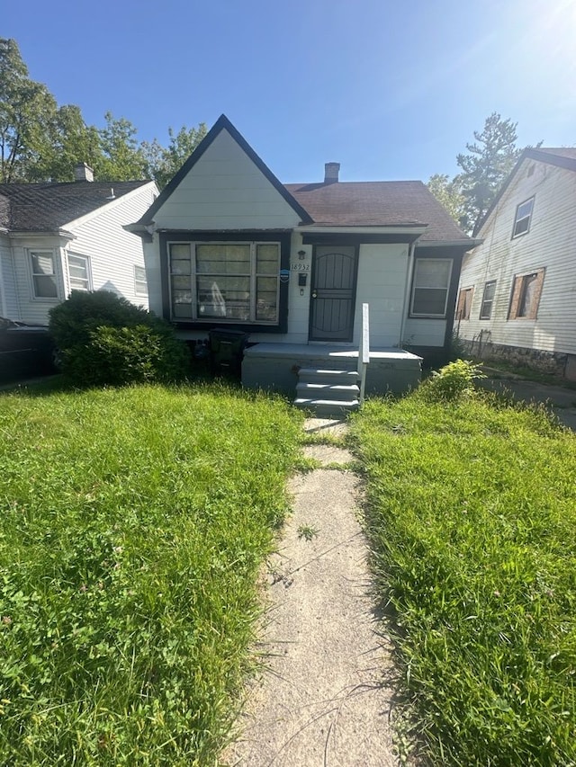 bungalow with a front yard