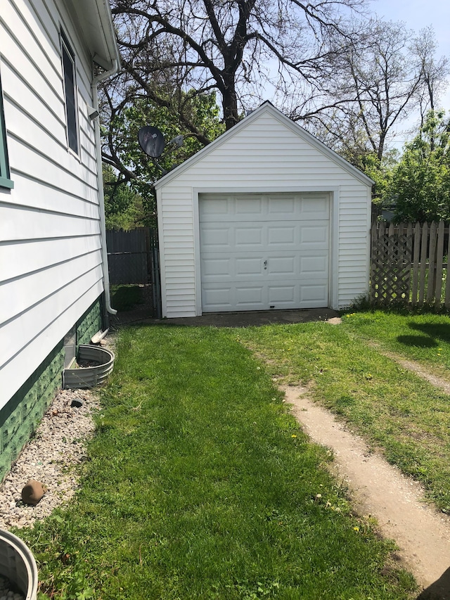 garage with a lawn