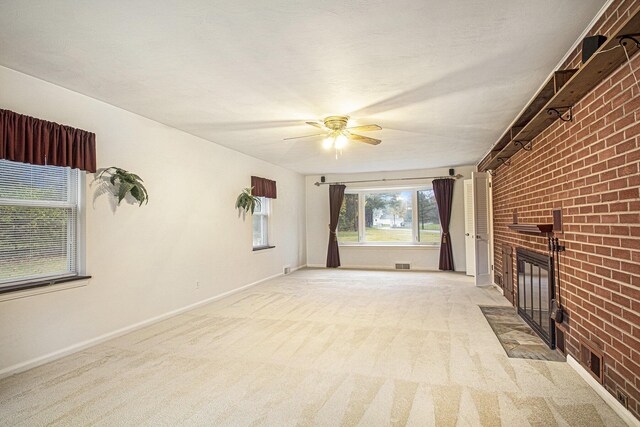 1806 Bond St, Niles, MI 49120 - unfurnished living room with a fireplace, a ceiling fan, light colored carpet, brick wall, and baseboards