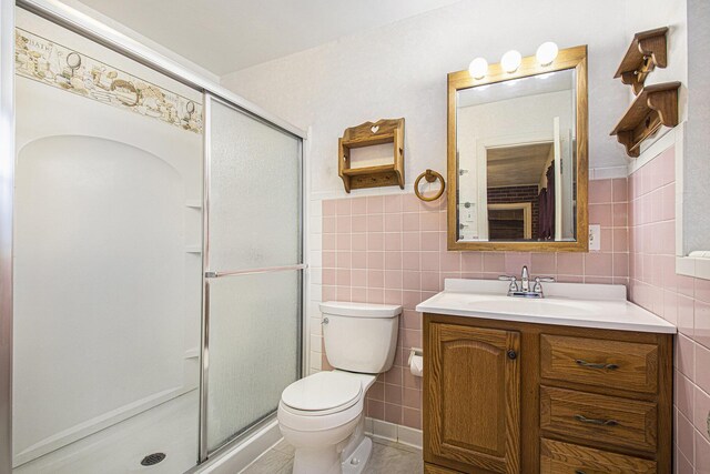 1806 Bond St, Niles, MI 49120 - full bathroom with tile walls, vanity, toilet, a stall shower, and a wainscoted wall