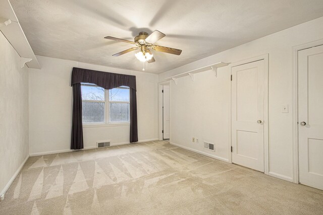 1806 Bond St, Niles, MI 49120 - unfurnished bedroom with light colored carpet, baseboards, and ceiling fan
