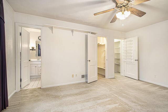 1806 Bond St, Niles, MI 49120 - unfurnished bedroom with light colored carpet, baseboards, connected bathroom, and a spacious closet