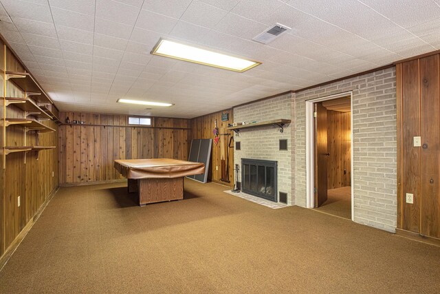 1806 Bond St, Niles, MI 49120 - game room featuring wood walls, a fireplace, and carpet