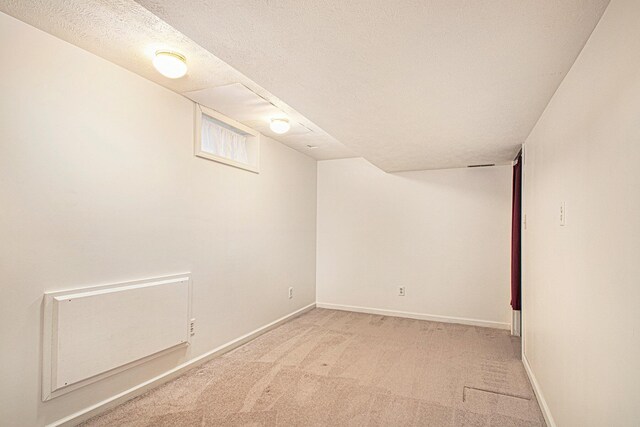 1806 Bond St, Niles, MI 49120 - finished below grade area with light carpet, baseboards, and a textured ceiling