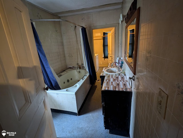 bathroom featuring vanity, shower / bath combination with curtain, and tile walls