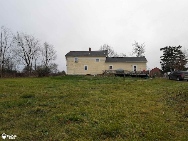 view of side of home featuring a lawn