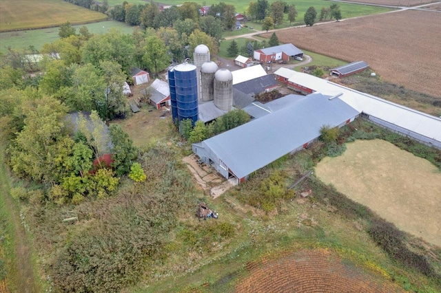 birds eye view of property with a rural view