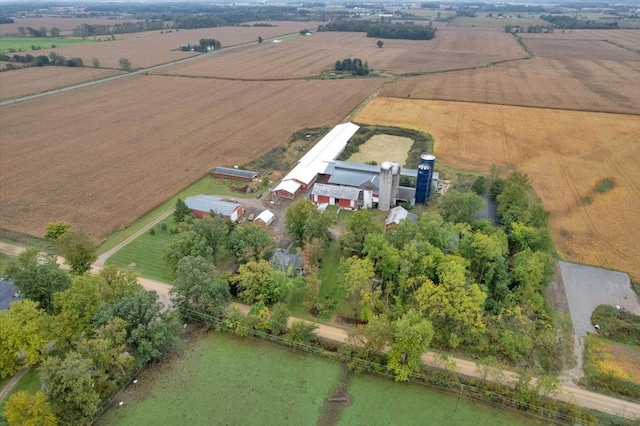 birds eye view of property with a rural view