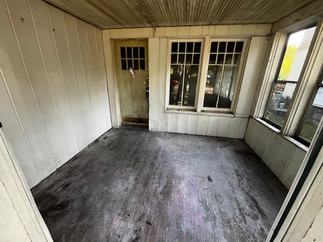 unfurnished sunroom featuring wood ceiling