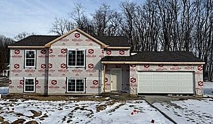 property in mid-construction with a garage