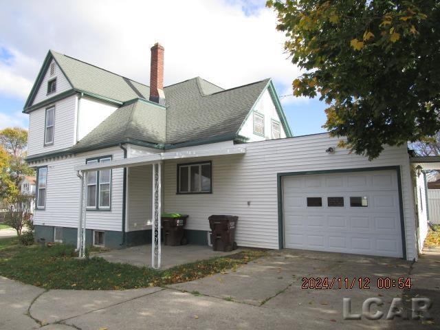 view of property exterior with a garage