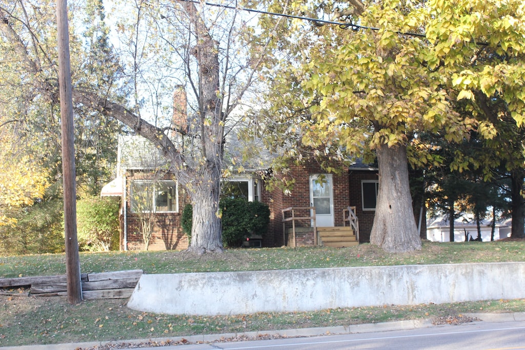 view of property hidden behind natural elements