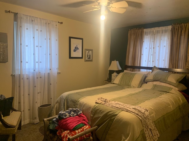 bedroom with ceiling fan and carpet