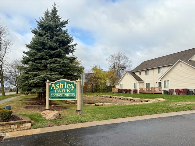 view of home's community with a yard