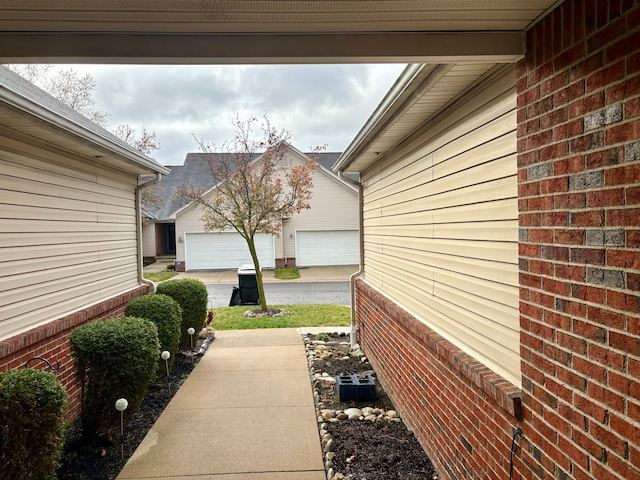 view of side of property with a garage