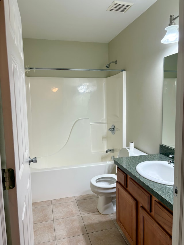 full bathroom featuring tile patterned floors, shower / washtub combination, vanity, and toilet