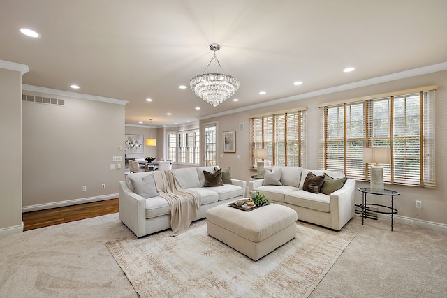 carpeted living room featuring an inviting chandelier and crown molding