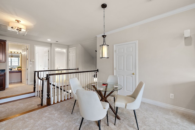 carpeted dining space with crown molding and lofted ceiling