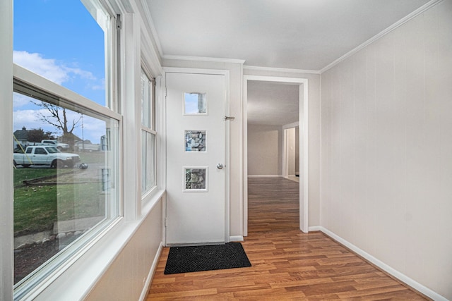 interior space featuring crown molding and light wood-type flooring