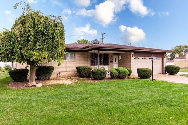 ranch-style home featuring a front lawn and a garage