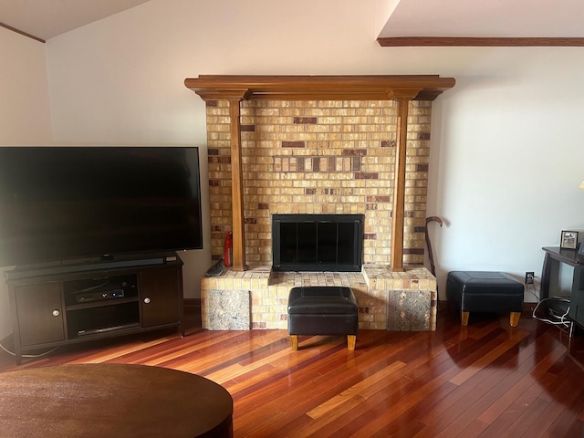 living room featuring crown molding and hardwood / wood-style floors