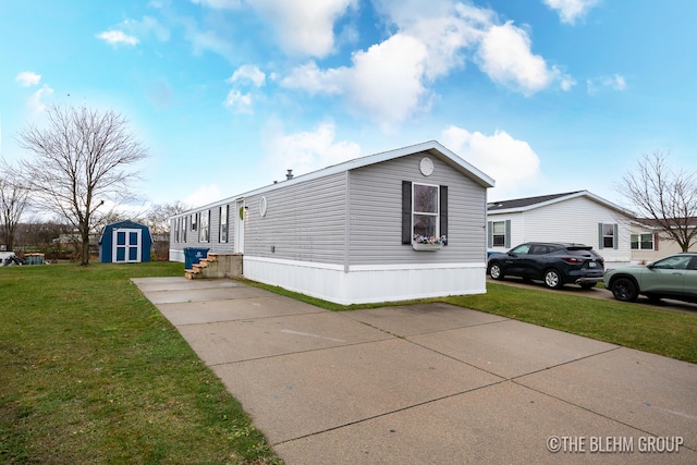 view of home's exterior featuring a lawn and a storage unit