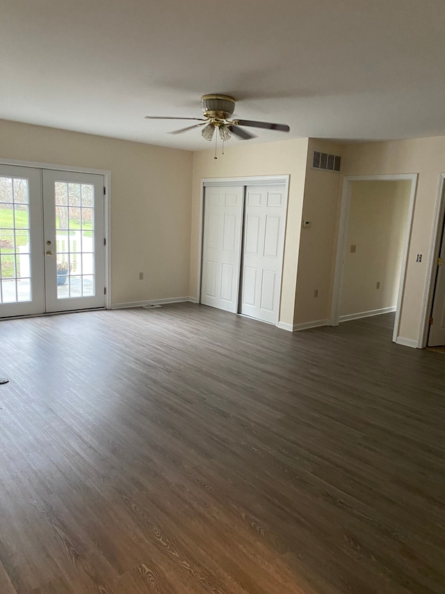 unfurnished bedroom with french doors, access to outside, ceiling fan, and dark wood-type flooring