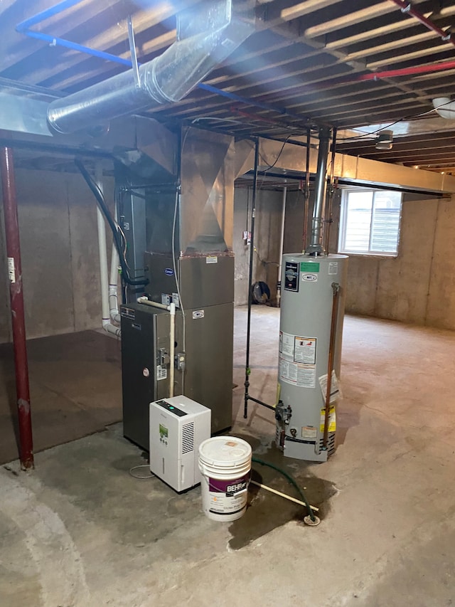 utility room with heating unit and water heater