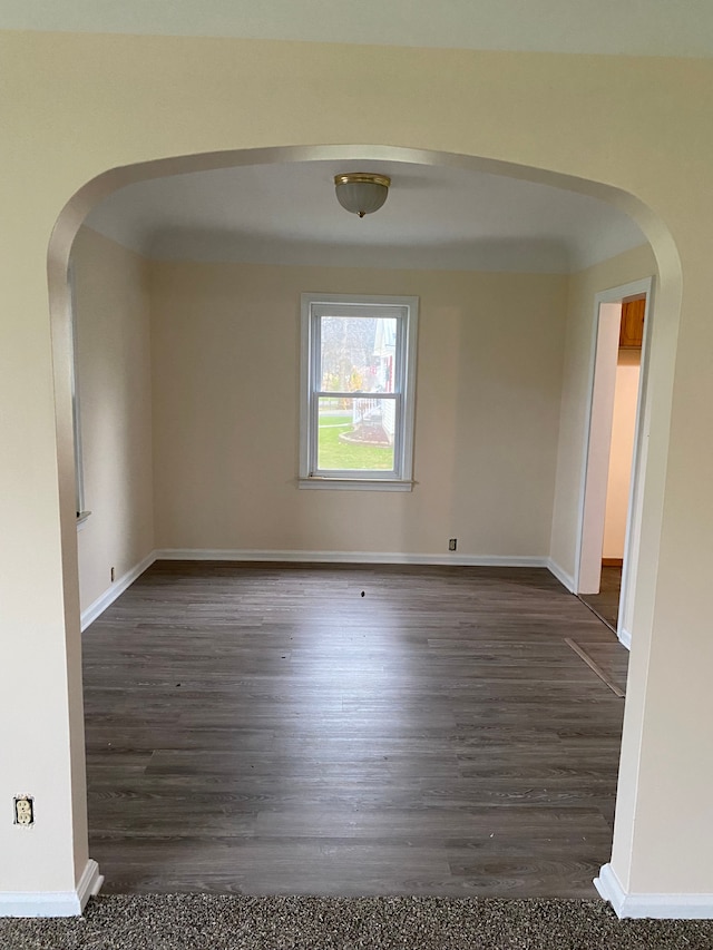 spare room featuring dark hardwood / wood-style floors