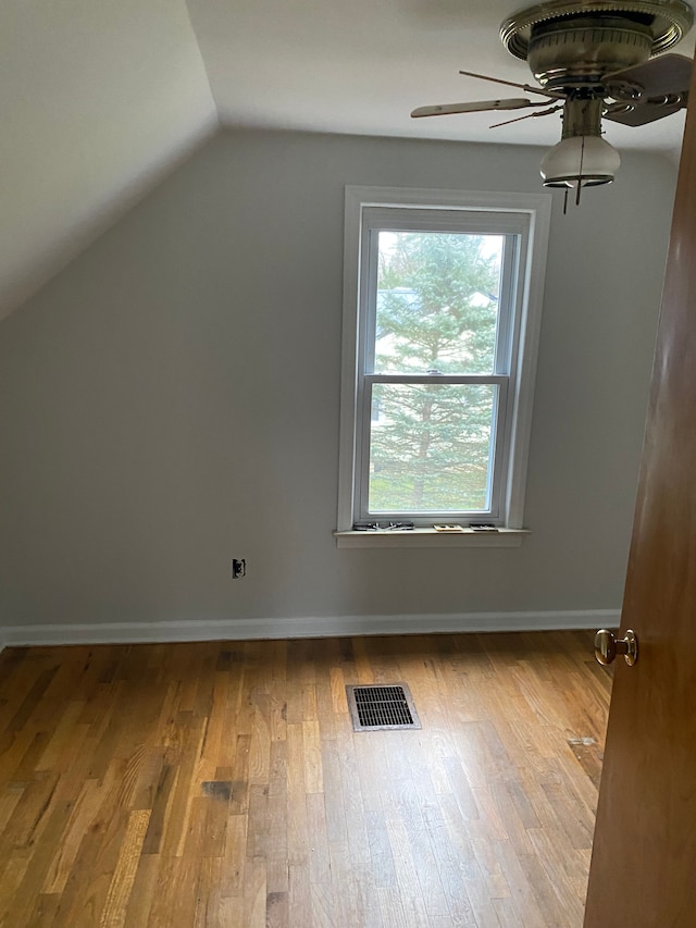 additional living space featuring ceiling fan, light hardwood / wood-style flooring, and lofted ceiling