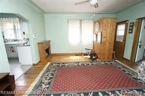 interior space with ceiling fan and wood-type flooring