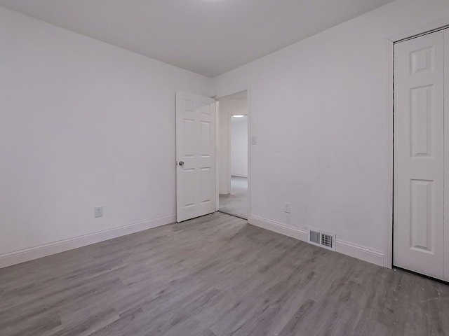 spare room featuring light wood-type flooring