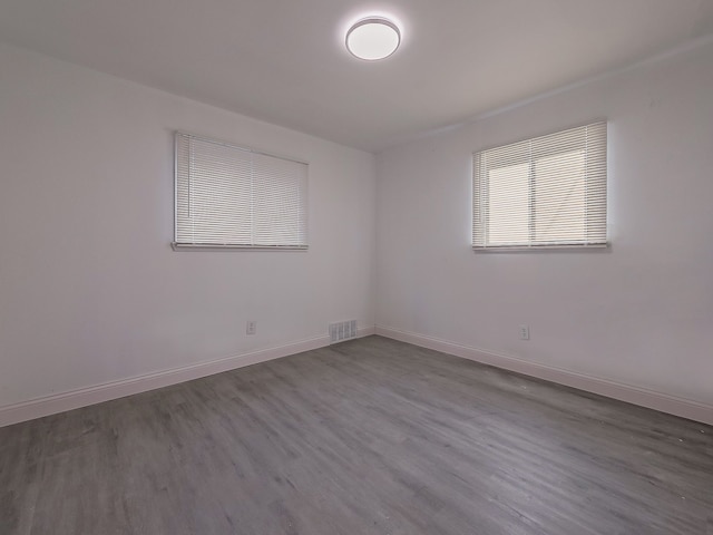 spare room featuring hardwood / wood-style floors