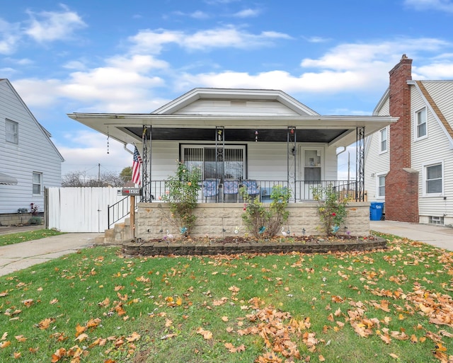 view of front of property with a front lawn and a porch