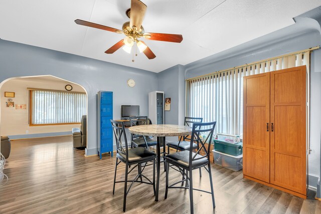 dining space featuring hardwood / wood-style flooring and ceiling fan