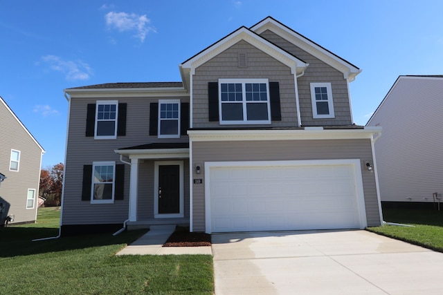 view of property with a garage and a front lawn