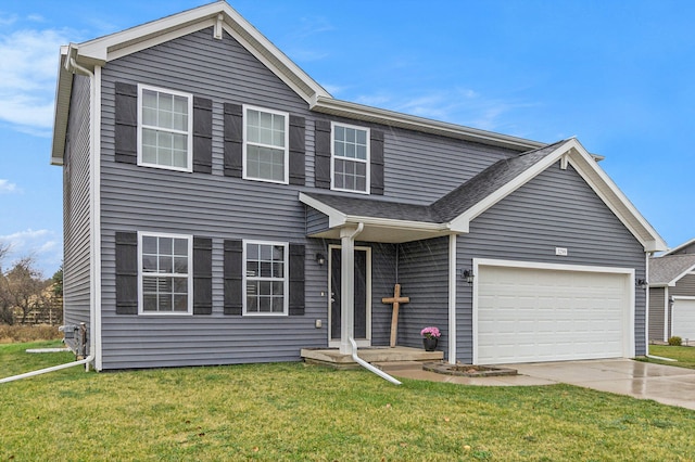 view of front of property featuring a garage and a front yard