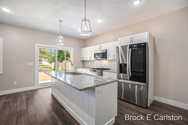 kitchen with white cabinetry, sink, dark hardwood / wood-style floors, and appliances with stainless steel finishes