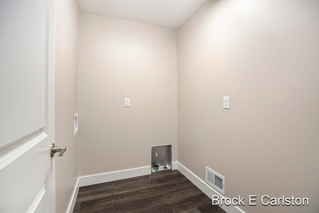 laundry room featuring hookup for a washing machine, dark hardwood / wood-style flooring, and hookup for a gas dryer