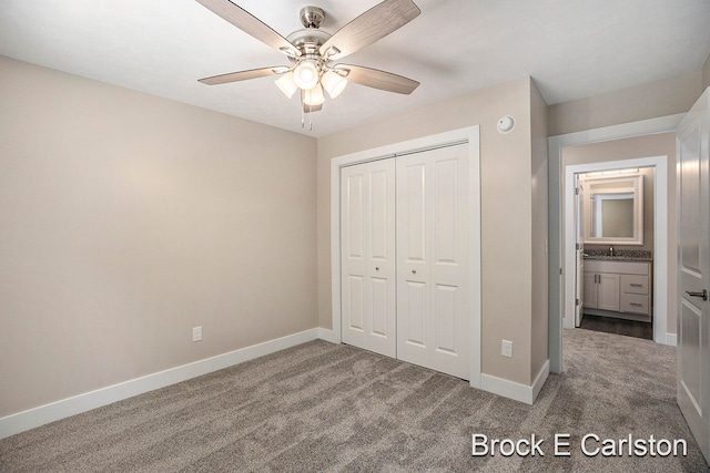 unfurnished bedroom featuring ceiling fan, carpet floors, sink, and a closet