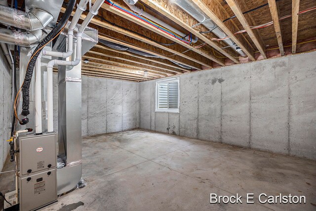 basement featuring heating unit