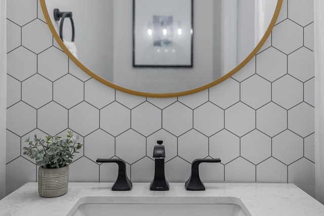 room details featuring tasteful backsplash and vanity