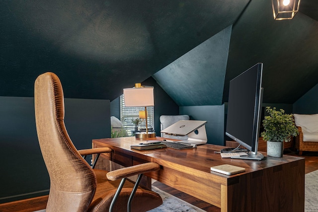 office featuring hardwood / wood-style flooring and lofted ceiling