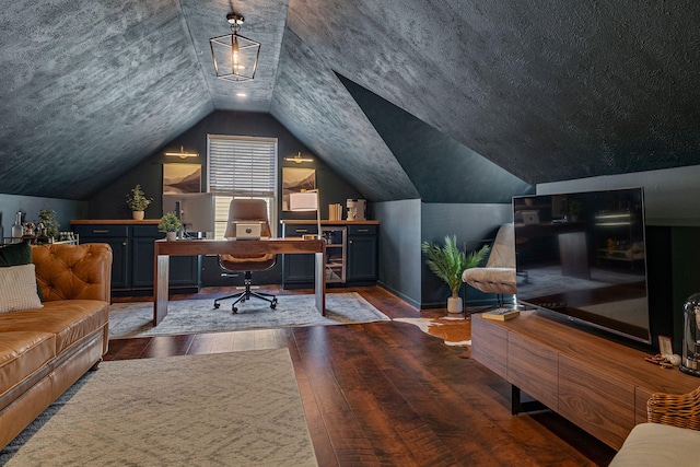 office with a textured ceiling, dark hardwood / wood-style flooring, and lofted ceiling