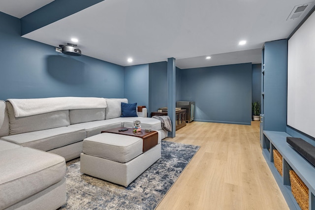 cinema room featuring light hardwood / wood-style floors